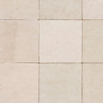 Close-up of square beige zellige tile wallpaper with handcrafted texture and subtle tonal variation
