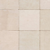 Close-up of square beige zellige tile wallpaper with handcrafted texture and subtle tonal variation