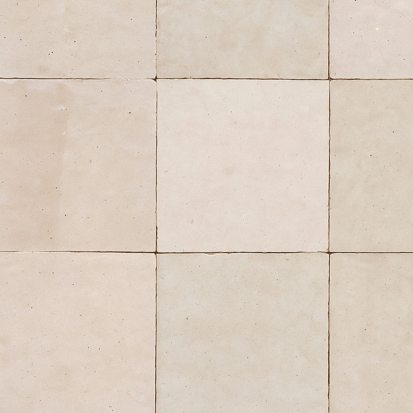 Close-up of square beige zellige tile wallpaper with handcrafted texture and subtle tonal variation