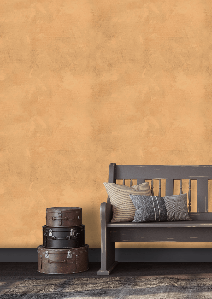 A cozy vintage entryway with a warm Arizona limewash wallpaper, styled with a wooden bench, striped cushions, and decorative vintage suitcases.