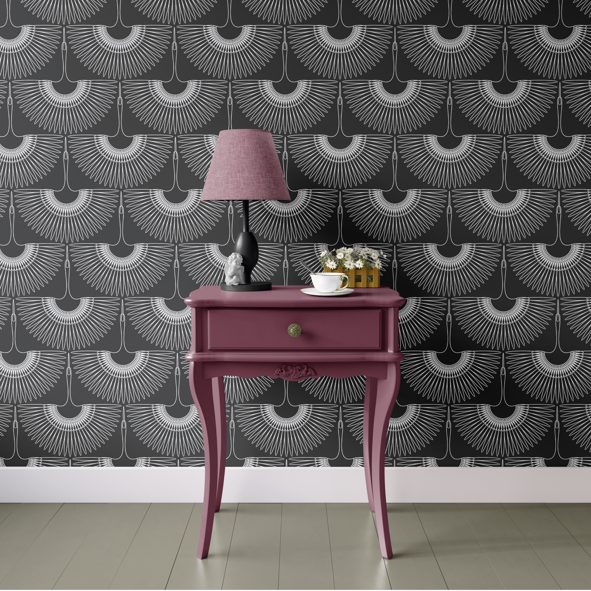 A modern room featuring black heron-patterned wallpaper, with a bold pink console table and a lamp, creating a striking contrast.