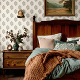 Classic bedroom decor with vintage-inspired blue floral wallpaper, traditional wood accents, and a nostalgic touch