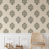 Traditional block print floral wallpaper with soft blue and neutral design in a cozy reading nook setting