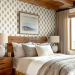 Rustic bedroom adorned with elegant blue floral wallpaper, cozy bedding, and natural textures for a timeless look