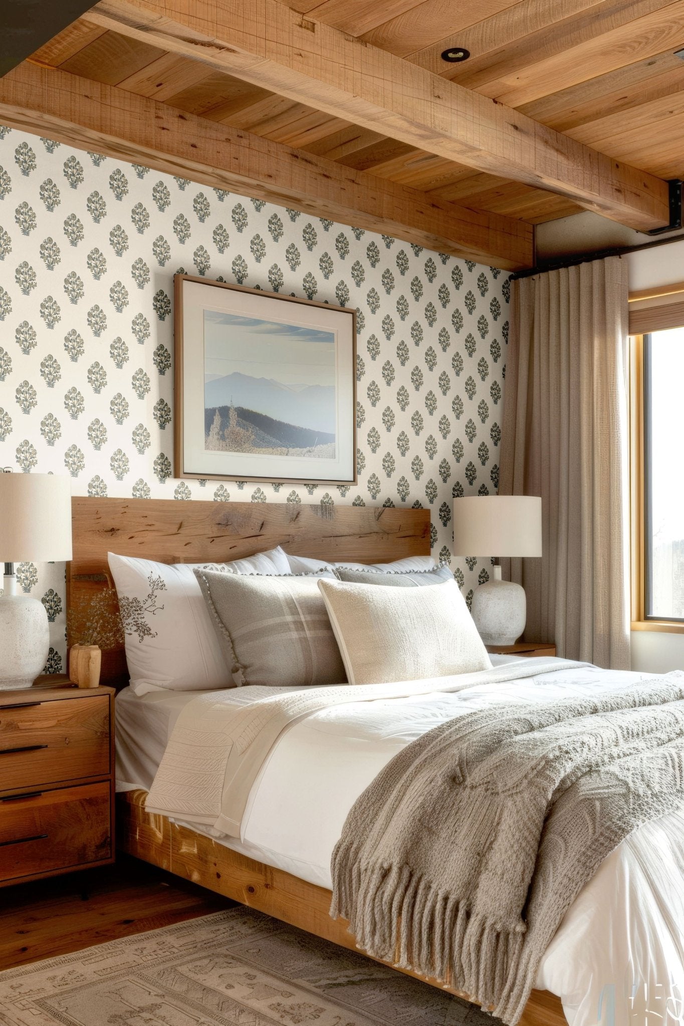 Rustic bedroom adorned with elegant blue floral wallpaper, cozy bedding, and natural textures for a timeless look