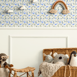 Nursery setup with Blueberry Fields wallpaper on an accent wall, creating a whimsical floral theme ideal for kids’ rooms or playrooms