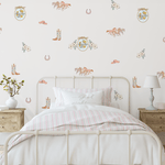 Floral cowboy boots, horses, and vintage western-themed wall stickers decorating a cozy cowgirl-inspired bedroom