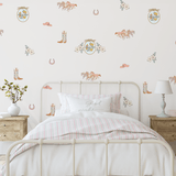 Western wall stickers with floral motifs, horses, and cowboy hats in a soft, pastel-themed nursery