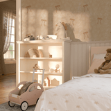 Children's bedroom with walls covered in soft beige wallpaper featuring delicate bow patterns, enhancing a cozy, playful atmosphere