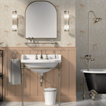 Bathroom featuring a wall-mounted sink with brass supports, a large arched mirror flanked by vertical light sconces, and a classic black clawfoot bathtub, set against a wall adorned with cream wallpaper featuring a subtle floral pattern and bows