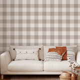 Neutral brown gingham wallpaper in cozy living room with cream sofa and accent pillows