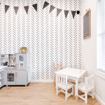 Black and White Chevron Herringbone wallpaper in a kids playroom with Ikea Kitchen