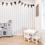 Black and White Chevron Herringbone wallpaper in a kids playroom with Ikea Kitchen