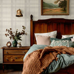 Cottage-style bedroom with Cream Tartan Wallpaper and warm lighting.