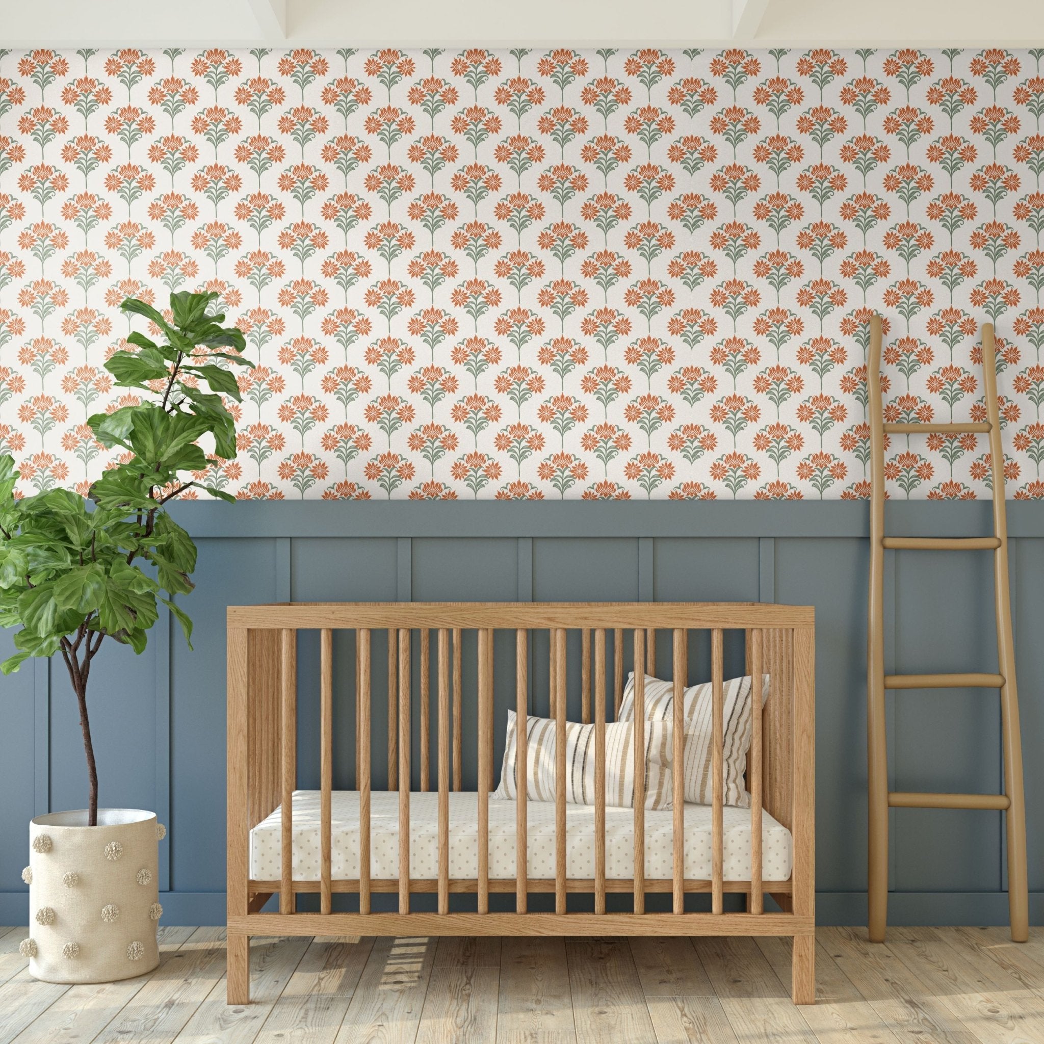  A beautiful nursery with wooden crib and floral damask wallpaper paired with a blue wainscot.