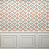 Close-up view of floral damask wallpaper showcasing intricate orange and green floral patterns.