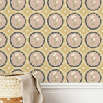 A basket with a beige linen cloth in front of a mustard yellow scalloped wallpaper with dusty pink floral medallion designs, creating a cozy and rustic aesthetic.