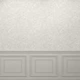 A room with a wooden floor and a light beige wallpaper featuring a delicate white floral pattern. The bottom portion of the wall has beige wainscoting with decorative molding, creating a cohesive and sophisticated appearance.