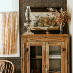 Vintage Cabinet Decor Paired with Folksy Wallpaper in Neutral Tones