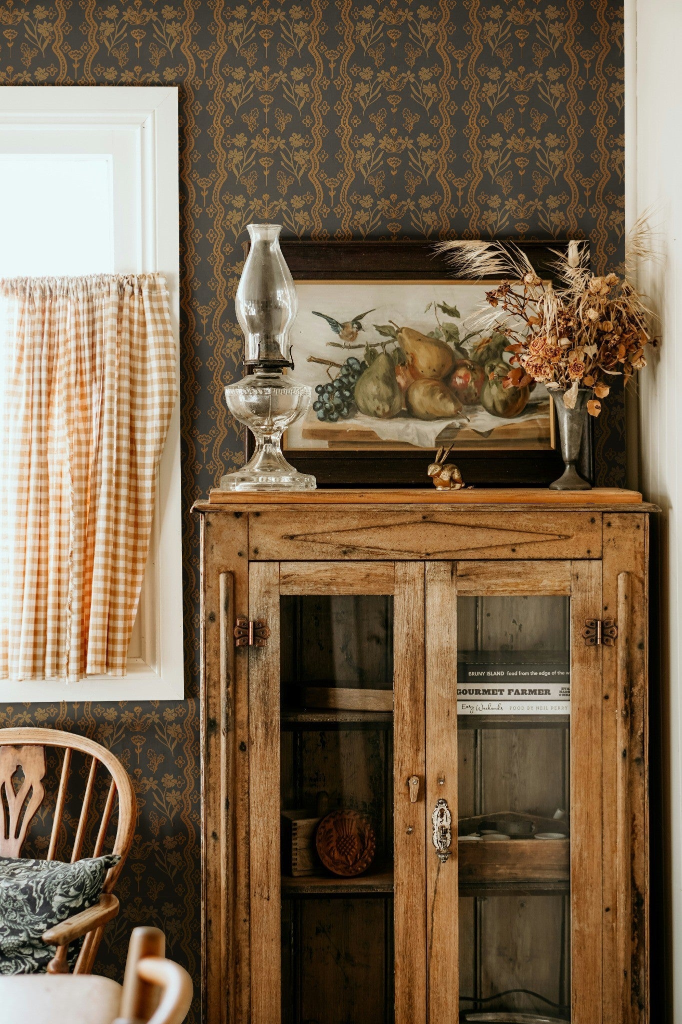 Vintage Cabinet Decor Paired with Folksy Wallpaper in Neutral Tones