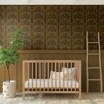 Muted Nursery Design Featuring Folksy Wallpaper and Natural Elements.