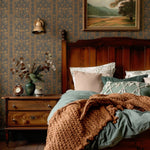 Farmhouse Bedroom with Green Bedding and Warm Folksy Wallpaper