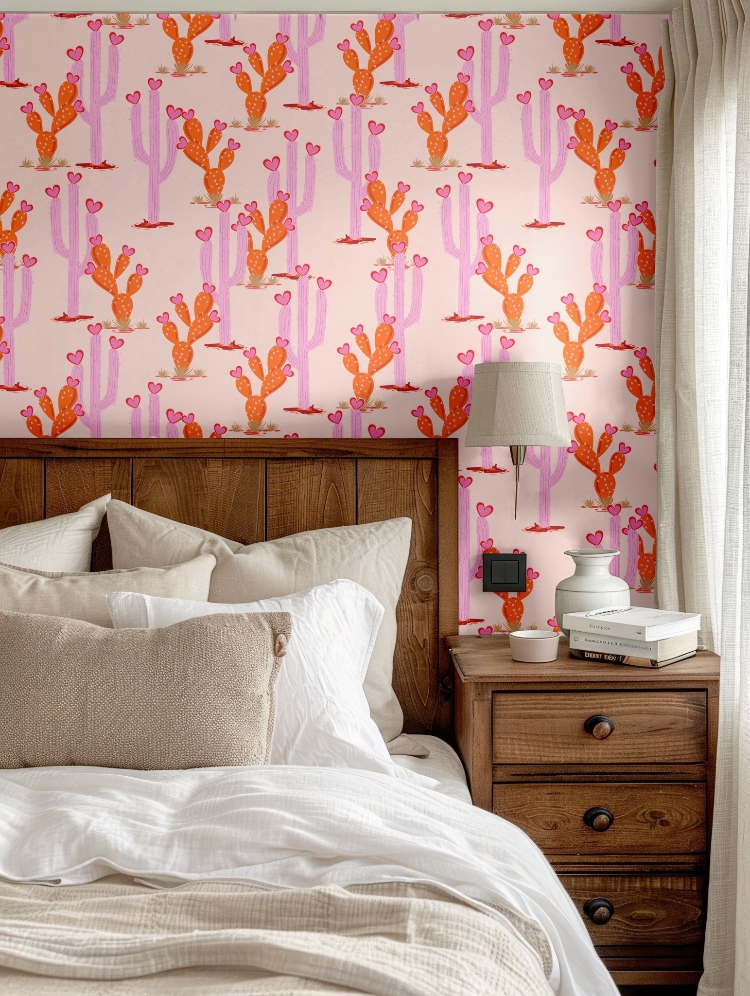 Modern rustic bedroom with pink cactus wallpaper, soft neutral linens, and a wooden nightstand for a stylish Southwestern touch