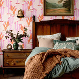 Classic bedroom with Western-style cactus wallpaper, vintage furniture, and warm textiles for a charming and nostalgic vibe