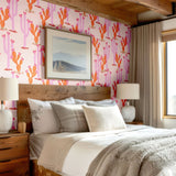 Light-filled bedroom showcasing a Southwest-style cactus wallpaper, neutral tones, and textured accents for a warm, inviting look