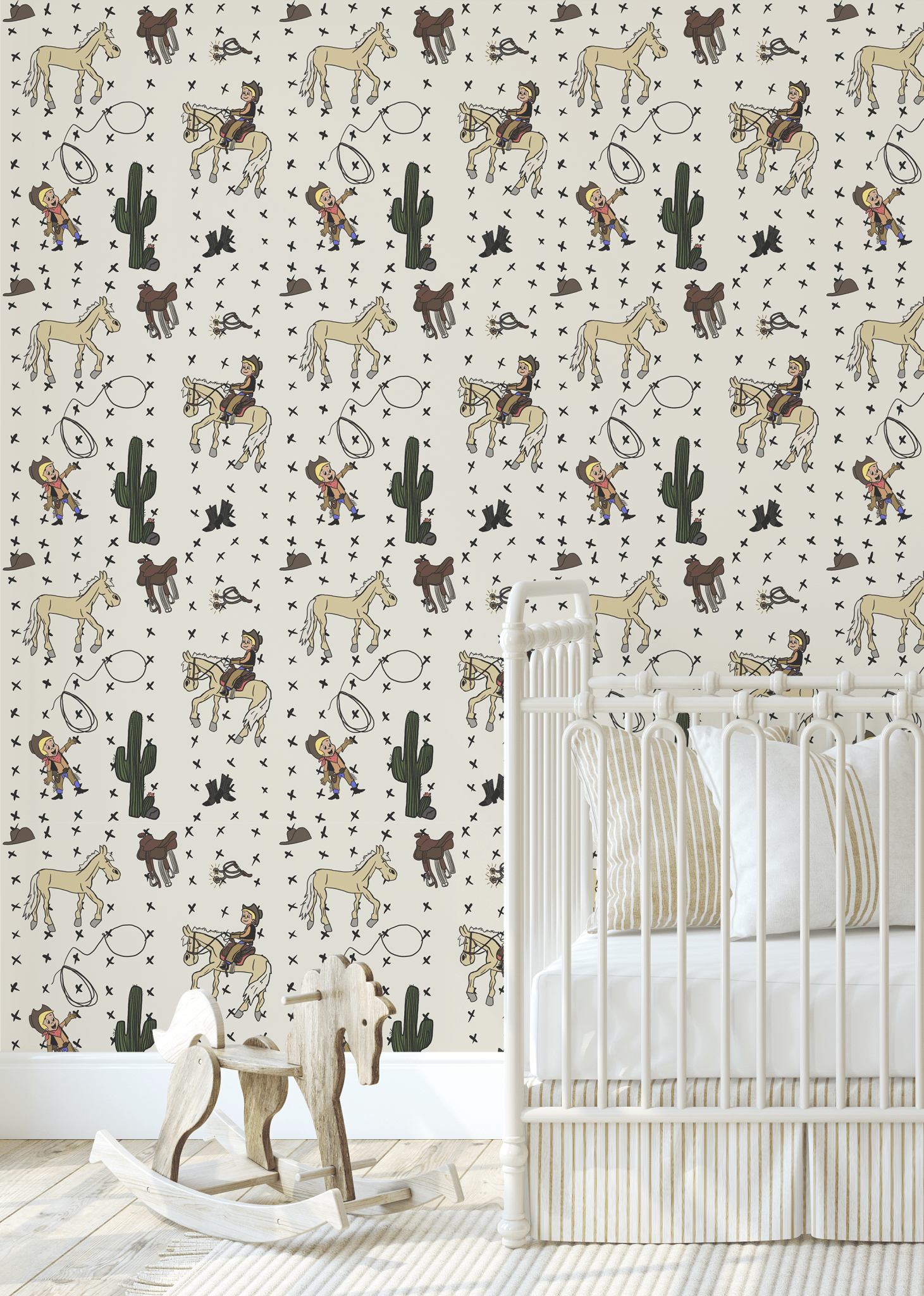 Western-themed wallpaper in a nursery, featuring cartoon cowboys, lasso, and horses on a beige background with cactus and cowboy hat illustrations