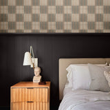 Bedroom with Mediterranean tile wallpaper behind the headboard, bringing warmth and texture with its soft, neutral tones and grid pattern