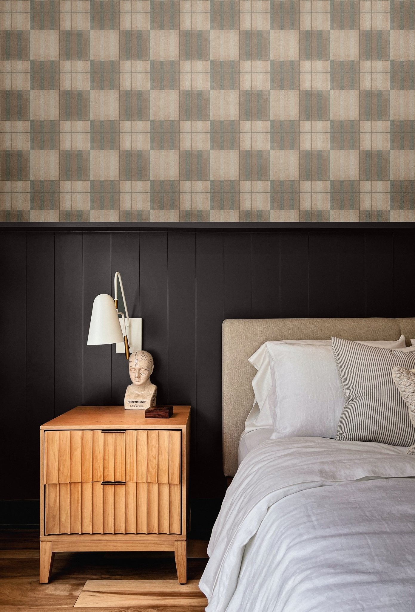 Bedroom with Mediterranean tile wallpaper behind the headboard, bringing warmth and texture with its soft, neutral tones and grid pattern