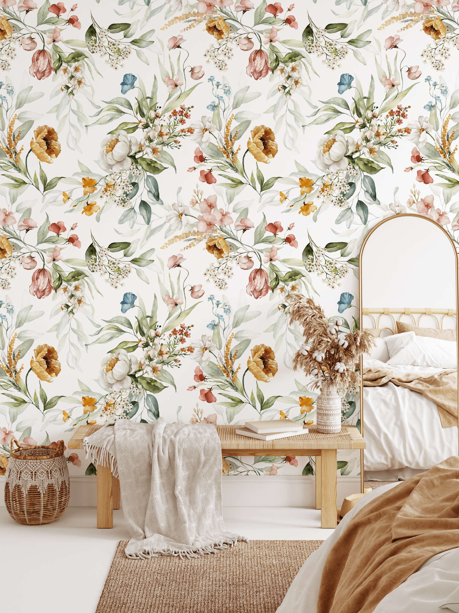 A cozy bedroom corner with a floral watercolor wallpaper, showcasing a bench with a cream throw blanket and a woven basket.