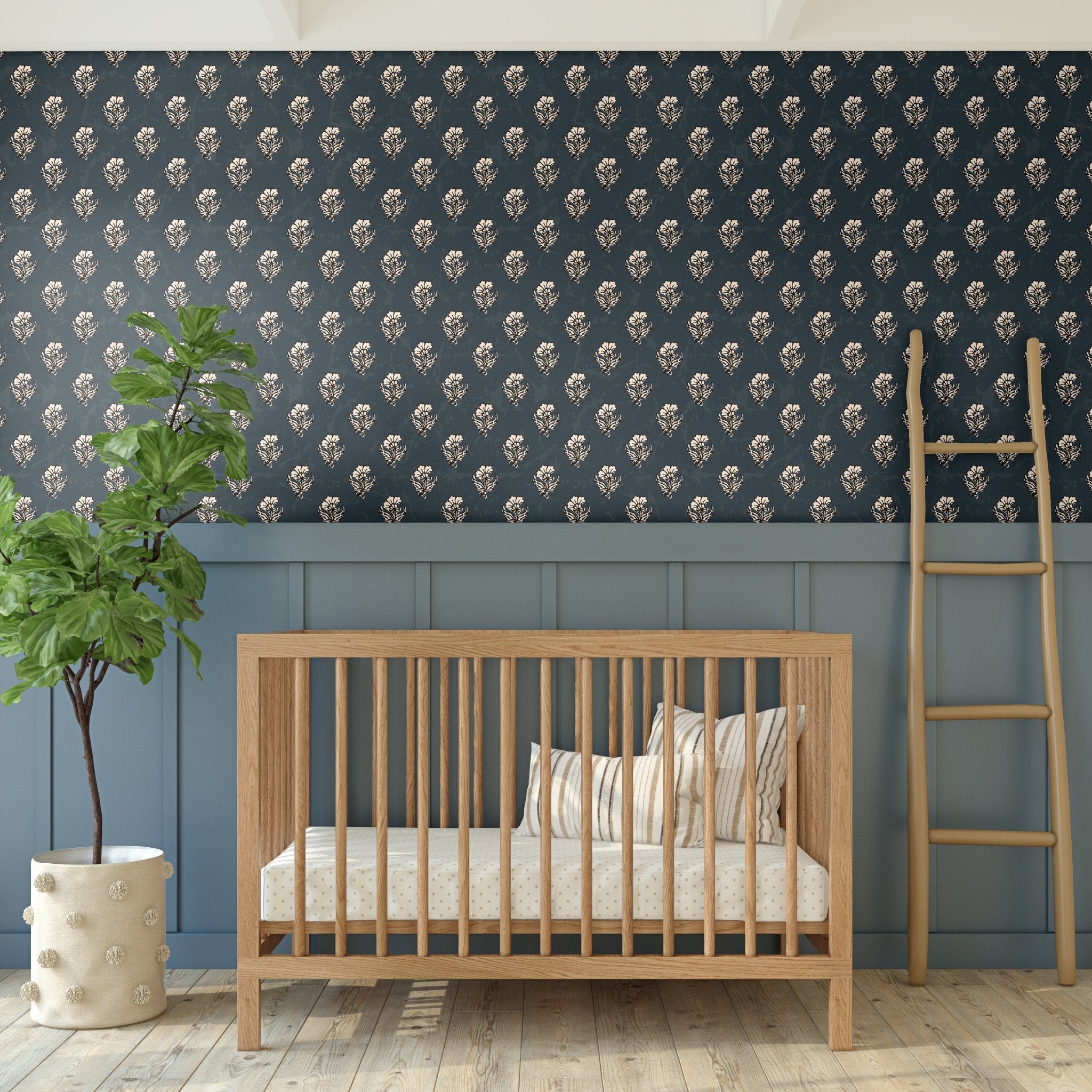 Navy blue nursery wallpaper with a classic floral pattern, paired with a wooden crib and a light wood ladder