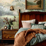 Oil Painting Landscape Wall Mural in a cozy cottage bedroom with wooden accents.