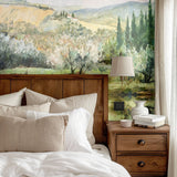 Farmhouse-style bedroom decor with a scenic landscape mural of rolling hills