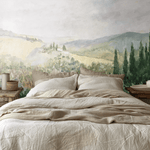 Vintage-inspired landscape mural on bedroom wall, adding warmth and rustic charm.