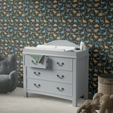 Colorful Prehistoric Pals Dinosaur Wallpaper in kids room with changing table