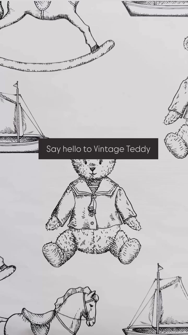 Say hello to Vintage Teddy wallpaper. This wallpaper has a white background with vintage teddys, sailboats, and rocking horses. 