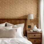 Warm-toned bedroom with Racing Pony wallpaper, wooden headboard, and beige bedding