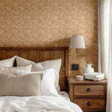 Warm-toned bedroom with Racing Pony wallpaper, wooden headboard, and beige bedding