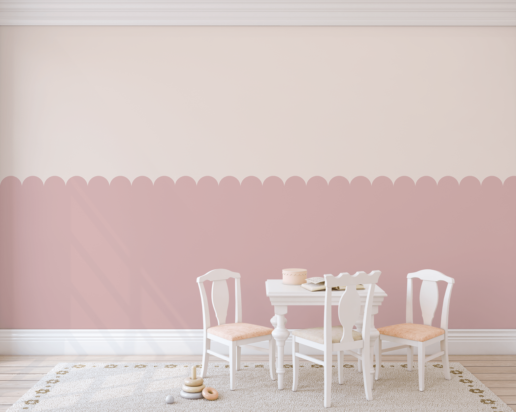 Close-up of pink scallop decals in a children's playroom for a subtle decorative touch.