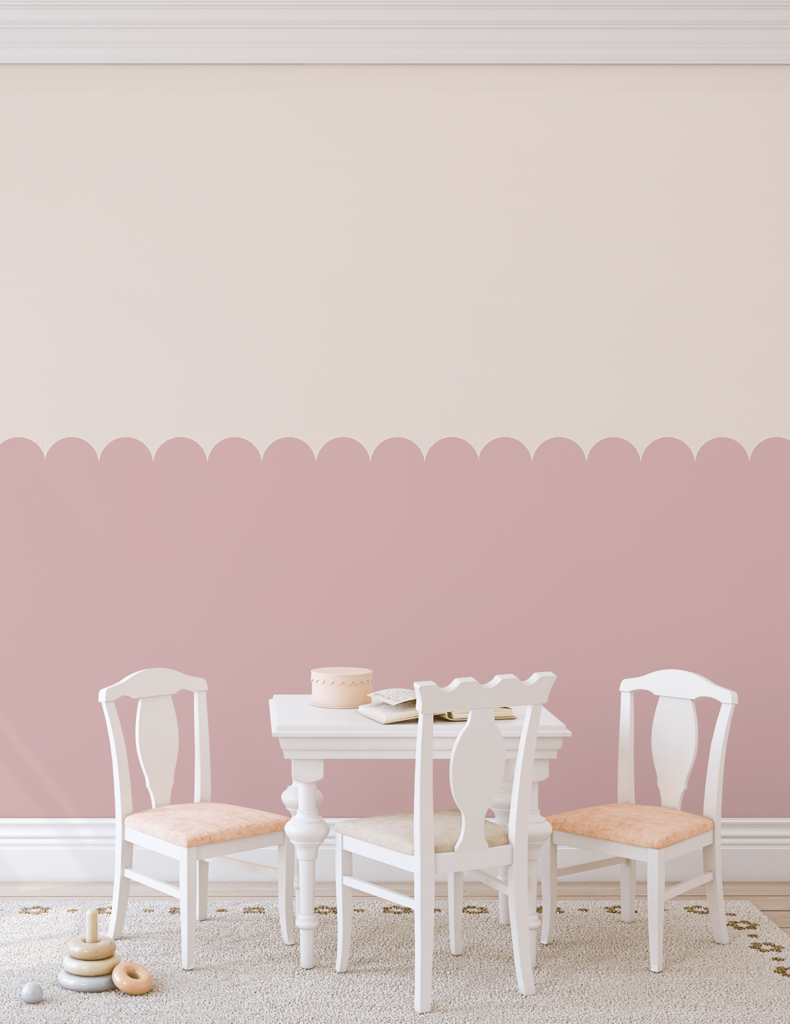 Soft dusty pink scallop wall panels in a playroom with white furniture.