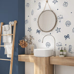 Navy coastal cowgirl decals in a modern bathroom with round mirror and wooden vanity