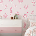 Pink coastal cowgirl wall decals in a girl's room with dresser and soft decor accents