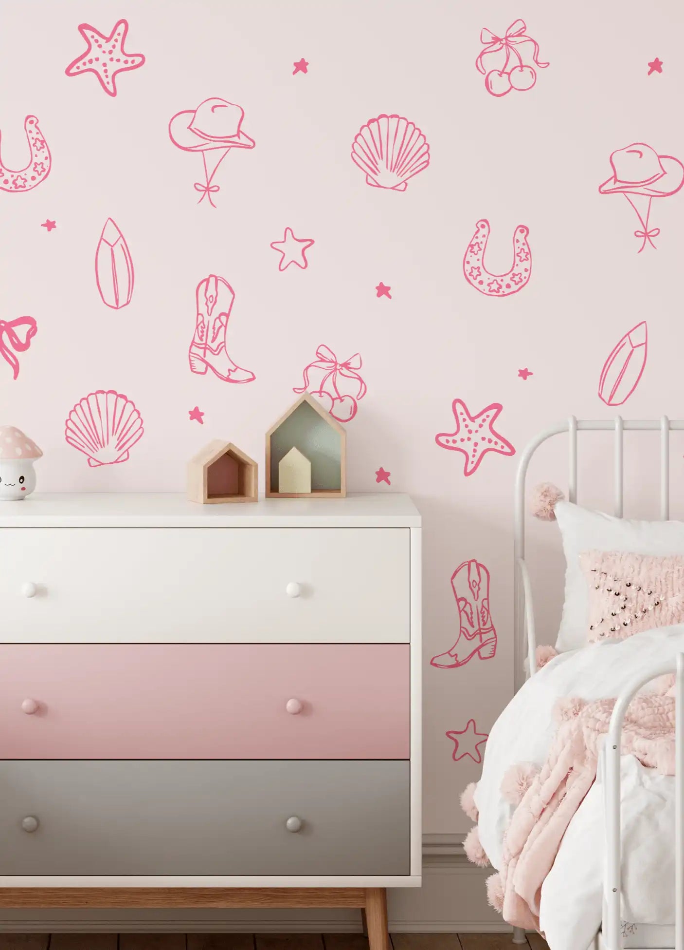 Pink coastal cowgirl wall decals in a girl's room with dresser and soft decor accents