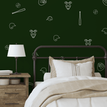 Dark green wall with white baseball outline decals, adding a sporty touch to a modern farmhouse-style bedroom.