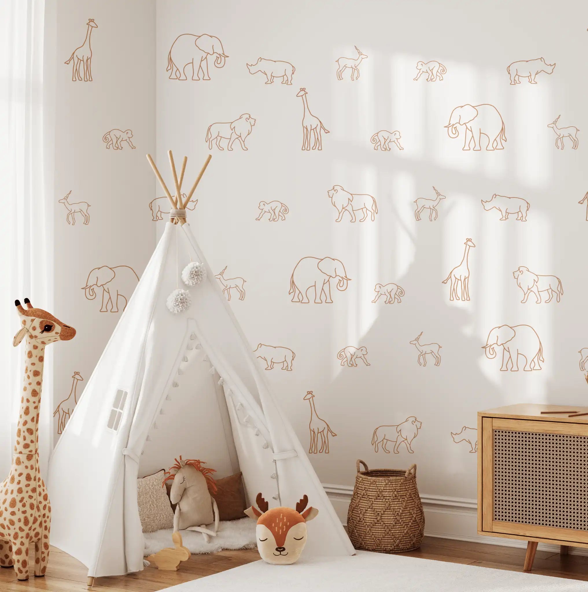 Rust-colored animal decals on white wall with a safari-themed teepee play area