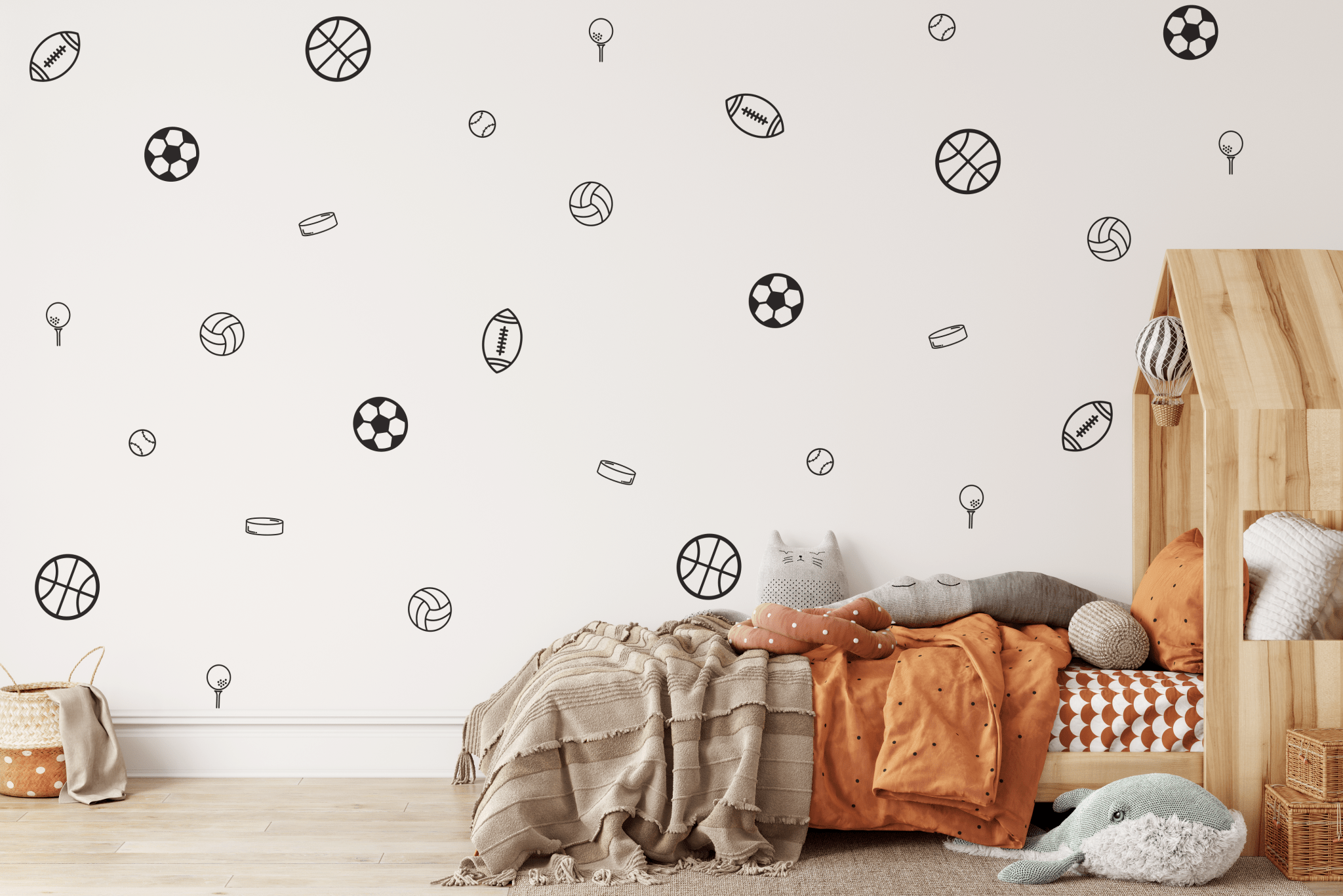 Outline sports wall decals on a light wall, decorating a sports-themed boys' room