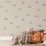 Children's bedroom with modern vehicle decals, showcasing customizable outlines of cars, trucks, planes, and more for boys' room decor